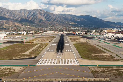 Burbank, California, USA - December 6, 2022:  Pilots point of view of runway approach at Hollywood Burbank Airport in the San Fernando Valley.