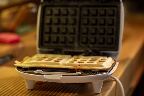 istock Cooking waffles stuffed with sausage, cheese. Pizza waffle, piffle. 1475133339