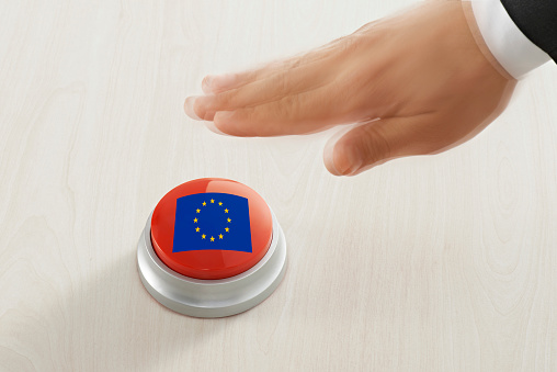 Businessman pushing a button with European Union flag
