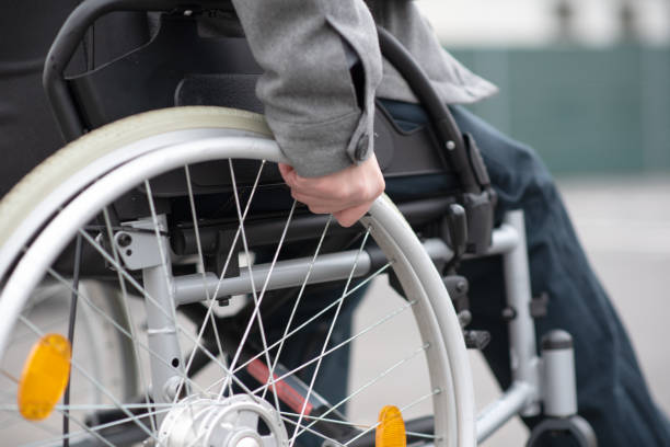 istock a hand on a wheelchair 1475133935