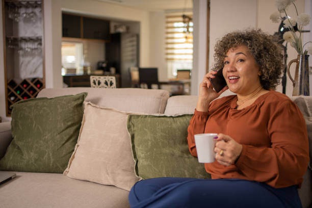 istock Happy mature woman using phone 1475136158