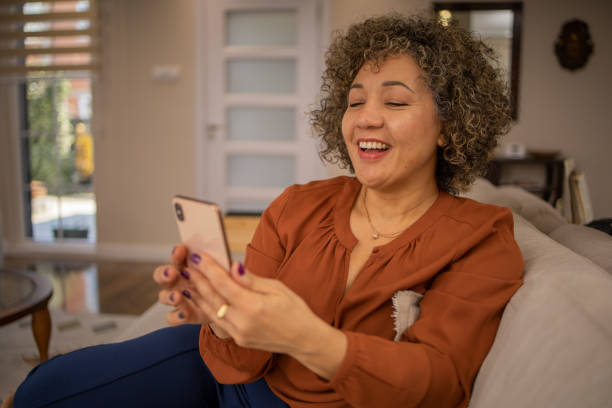 istock Happy mature woman using phone 1475136166