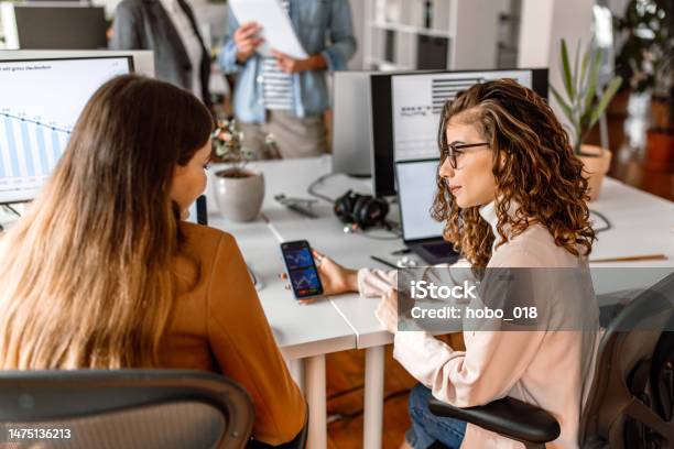 Colleagues Analysing Crypto Stock Market In The Office Stock Photo - Download Image Now