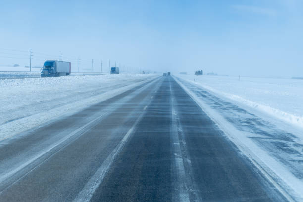 istock icy road. winter storm on highway. snow and black ice 1475138518