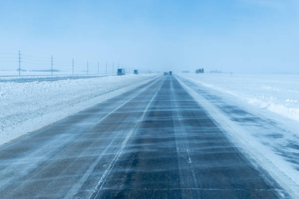 icy road. winter storm on highway. snow and black ice