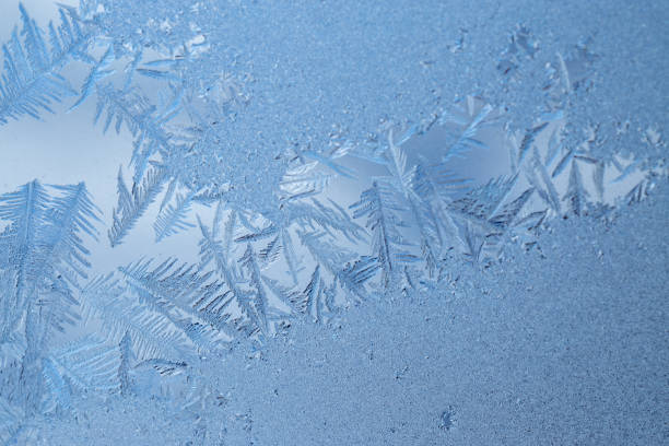 istock frost on glass.  Abstract frosty pattern on glass 1475138644