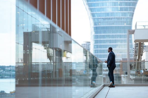 African American businessman in a modern environment looking and thinking