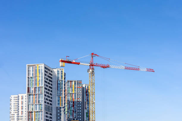 istock Tower cranes near the residential building 1475145695