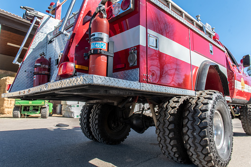 Fire truck with sunlight seen in perspective from behind