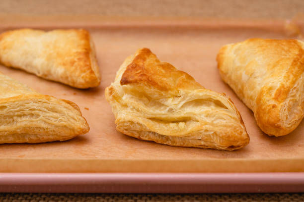 istock Apple turnover, or apple strudel close-up on a baking pan 1475147979