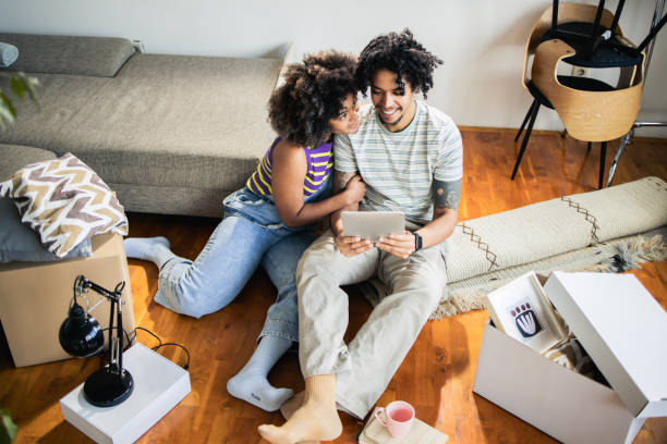 istock Portrait of a happy couple using tablet at home 1475149165