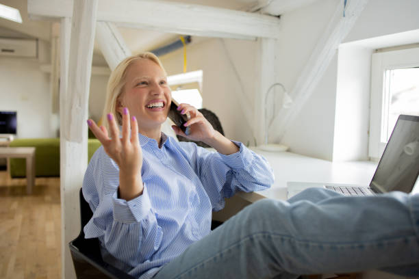 istock Happy young woman using phone 1475150015