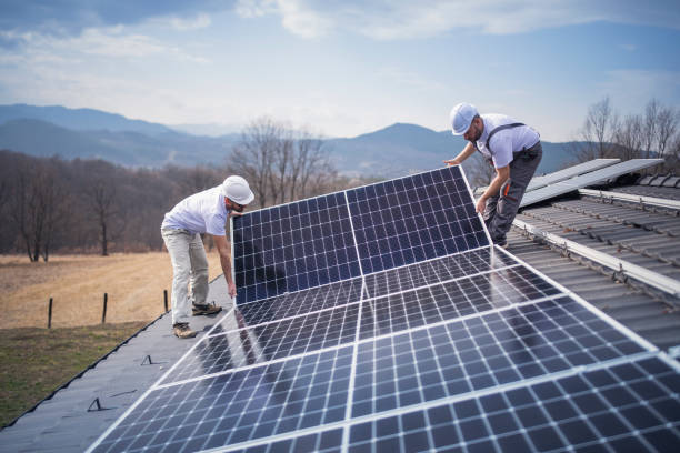 istock Caucasian men installing panels on roof. 1475150435