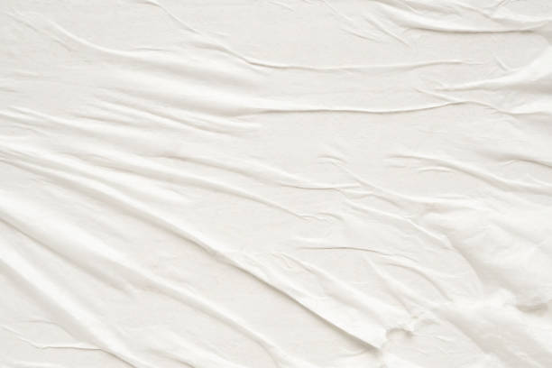 istock White blank crumpled and creased paper poster texture background 1475150504