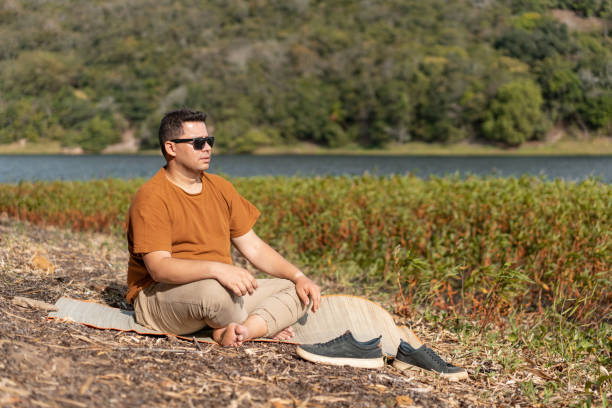Man sitting in front of the river
