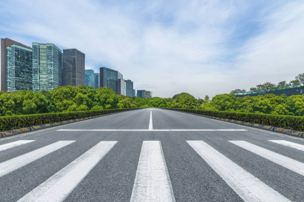 istock empty road with zebra crossing and skyscrapers in modern city 1475157241