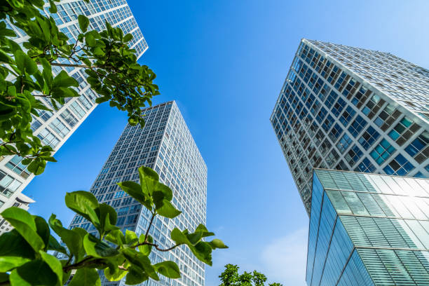 istock modern office building with green leaves 1475157267