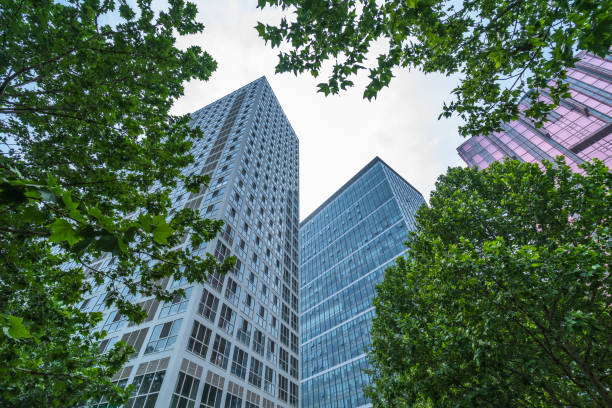 istock modern office building with green leaves 1475157411