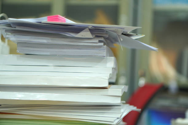 istock Pile of unfinished documents on office desk, Stack of business paper 1475158446