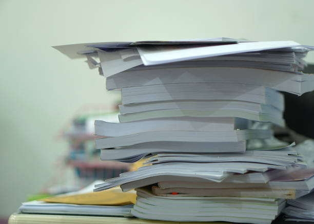 istock Pile of unfinished documents on office desk, Stack of business paper 1475159032