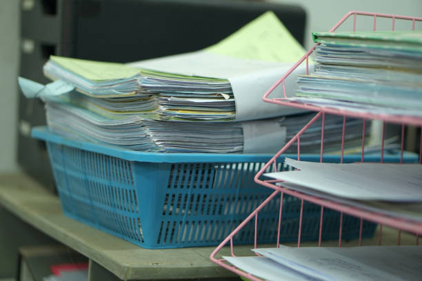 istock Pile of unfinished documents on office desk, Stack of business paper 1475159033