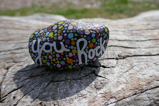 You rock message painted with polka dots on kindness rock