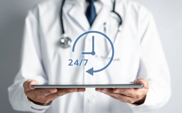 istock Nonstop service 24 hr concept. Doctor hand holding virtual 24/7 with clock on hand for worldwide nonstop and full-time available contact of service concept. customer service. 1475162654