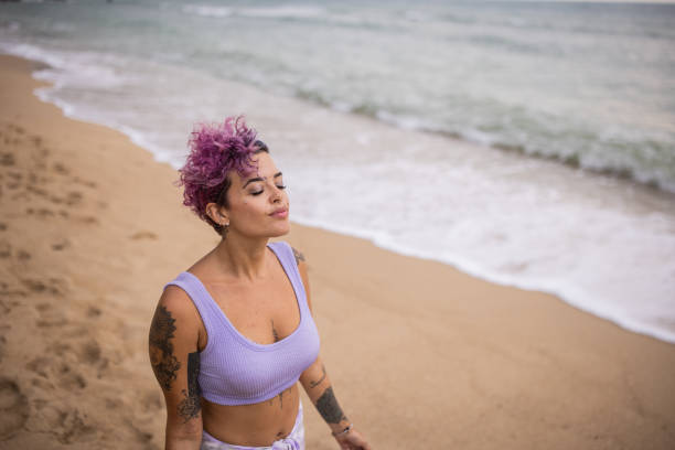 istock Woman enjoying sea breeze 1475163164