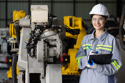 Portrait of female engineer in factory