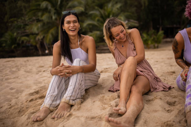 istock Friends relaxing on the beach 1475164490