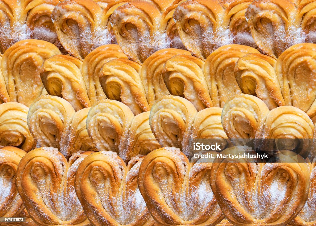 Puff pastry cookies palmier or elephant ears, caramelized and crunchy pastry. White background, top view. Appetizer Stock Photo