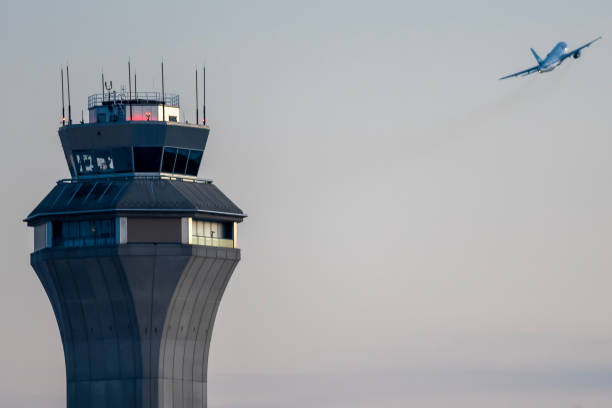 istock Airport control tower during takeoff airplane 1475180961