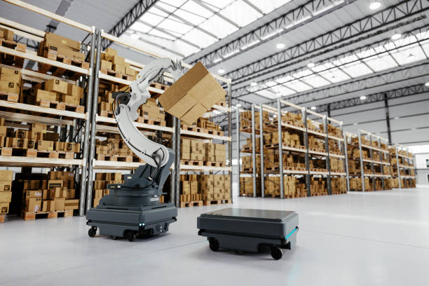 istock Automated Robot Carriers And Robotic Arm In Smart Distribution Warehouse 1475181027