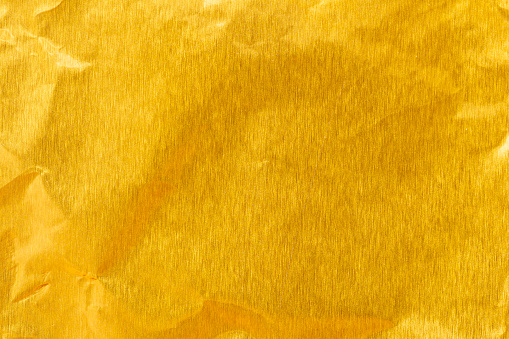 Gold paper sheet texture cardboard background.