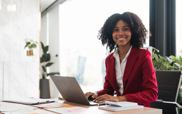 istock Black woman sitting in front laptop of her, office work 1475183627
