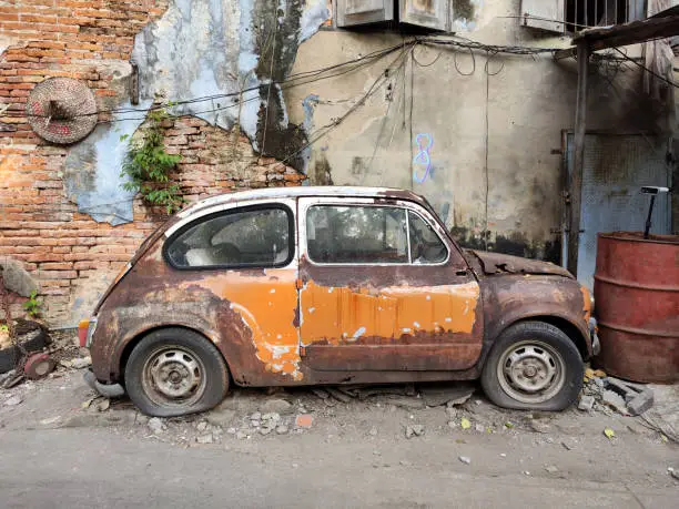 The famous abandoned old Fiat 600 along a alley in Talad Noi, a historic neighbourhood in Bangkok. On the periphery of Bangkok's Chinatown, the area was Bangkok's first port, and was where immigrants landed. Thailand