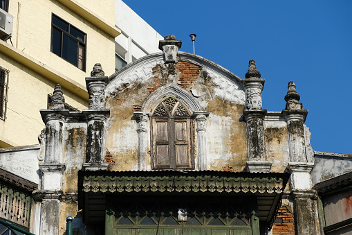 Century old corner house architecture at Ratchawong-Song Wat road, in Bangkok's Chinatown, Thailand