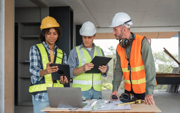engineer in working site with blueprints, inspection in workplace for architectural plan, construction project ,Business construction