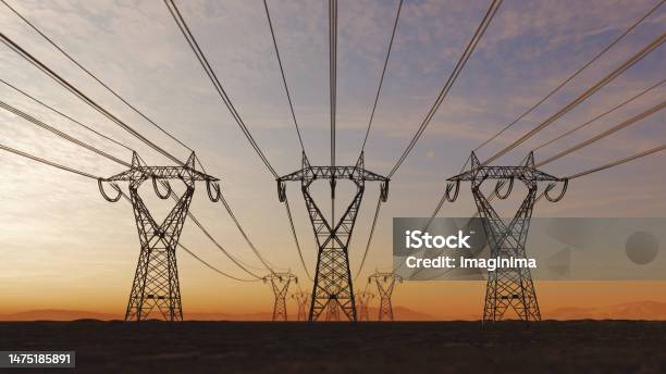 High Voltage Electric Power Lines At Sunset Stock Photo - Download Image Now - Power Line, Electricity, Communications Tower