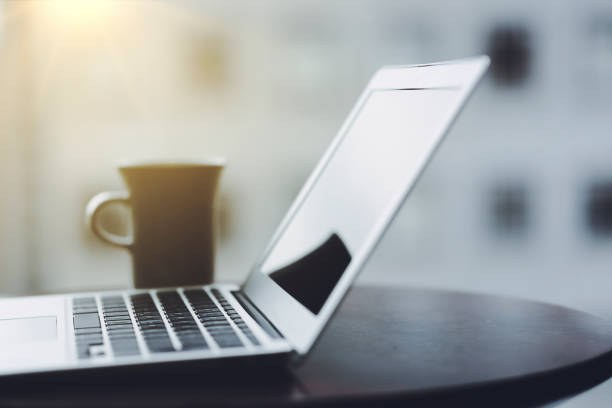 istock Laptop business image by the window 1475187094