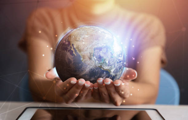 istock Businessman holding in hands with global connection concept. Energy saving concept, Elements of this image furnished by NASA 1475189313