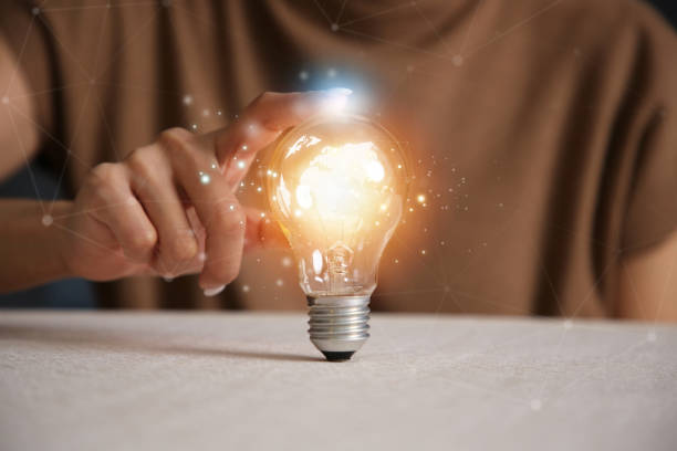 istock Hand holding light bulb. idea concept with innovation and inspiration 1475190017