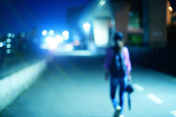 istock People walking in the night city 1475191392