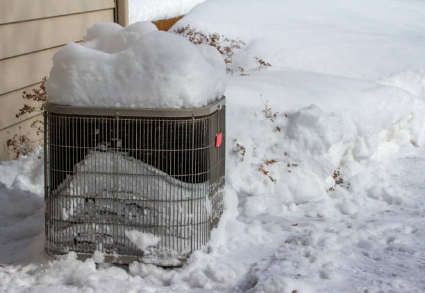 istock Exterior air conditioner unit covered with deep snow 1475191591