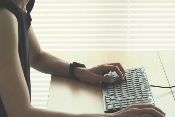 istock female operating pc at home 1475191726