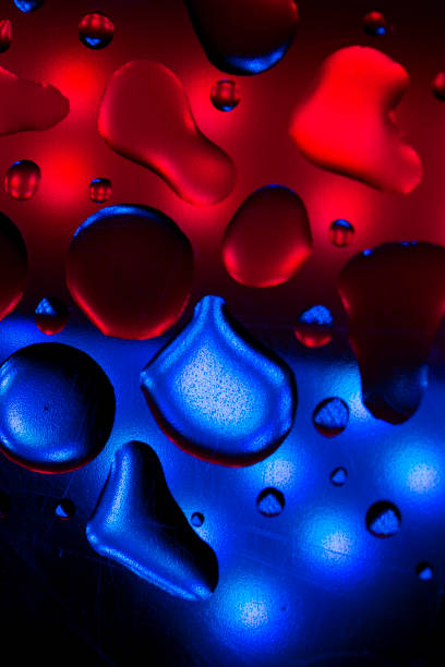 istock wallpaper drops Blue and pink colors.Bubbles in neon light.Fluid texture.Drops texture with iridescent gradients. 1475192395