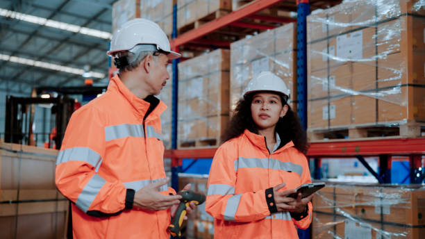 istock New Asian Warehouse Worker Learning about Systems and Stocktaking from Manager. 1475192606