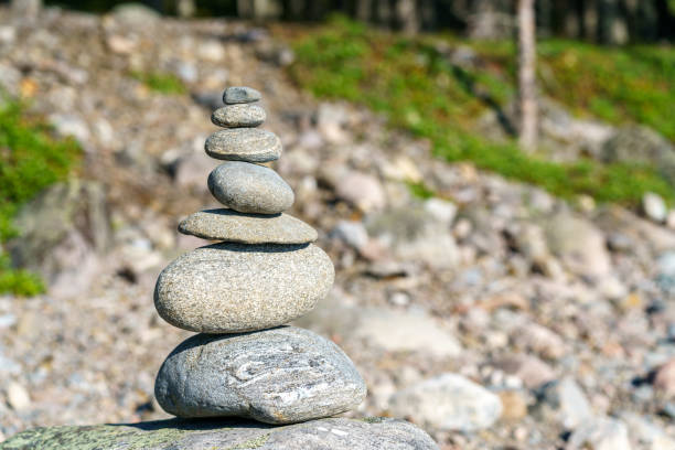 istock Pyramid of stones. Unstable balance of stone objects. 1475198483