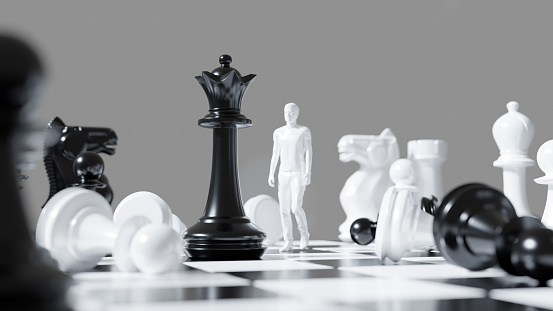 White male figure walking at chessboard against black queen chess piece. Leadership concept