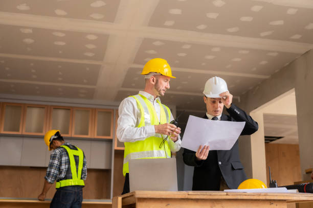 istock Construction and structural concept engineers working on drawings at blueprints meeting for projects working with partners on modeling and engineering tools used in real estate concept construction 1475202058